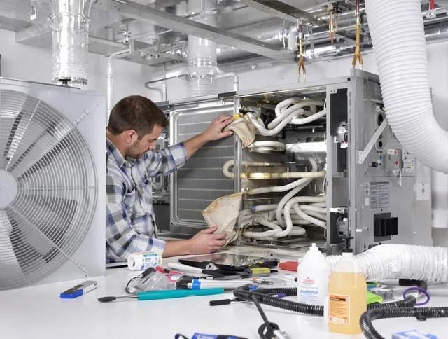 Norfolk Air Duct Cleaning specialist performing precision AC coil cleaning in Norfolk