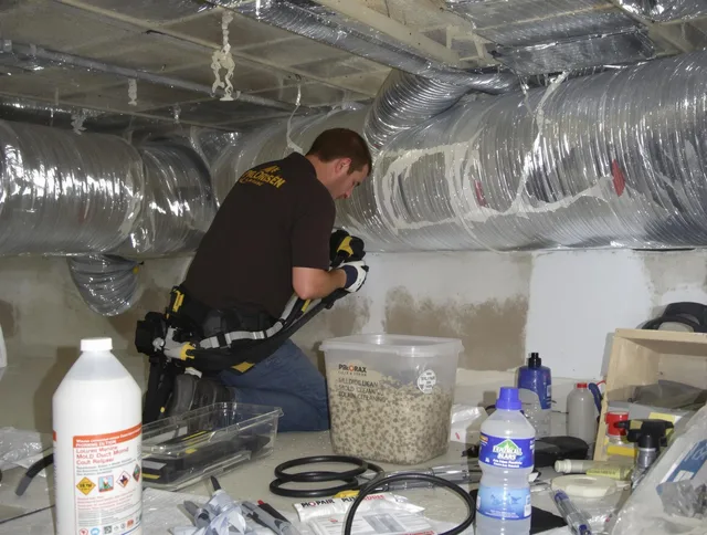 Norfolk Air Duct Cleaning specialist performing professional mold removal from air ducts in Norfolk