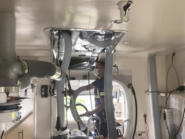 Norfolk Air Duct Cleaning specialist performing precise mobile home duct cleaning in Norfolk